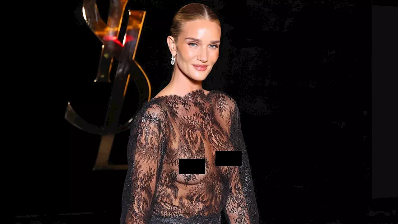 Rosie Huntington-Whiteley Wears Sheer Black Lace Dress Without Bra at Saint Laurent Fashion Week