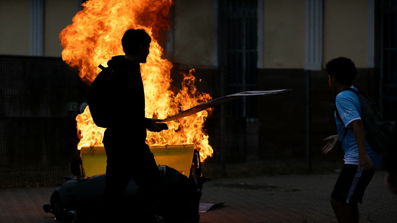 Market Developments: Woman set alight as French protests spiral