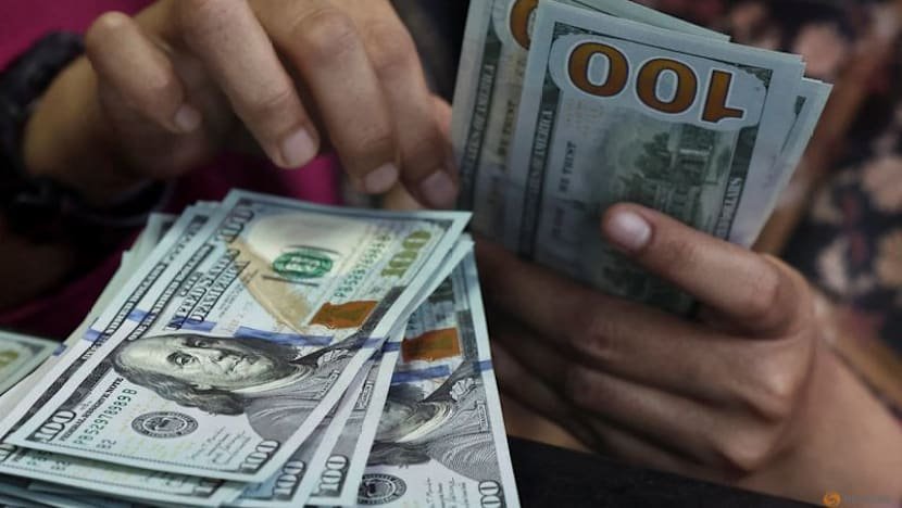 Dollar holds near two-month peak as yields rise, Fed data looms