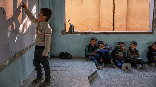 Developing Story: Nearly two years after the fall of Assad, Syrian children return to school amid ruins