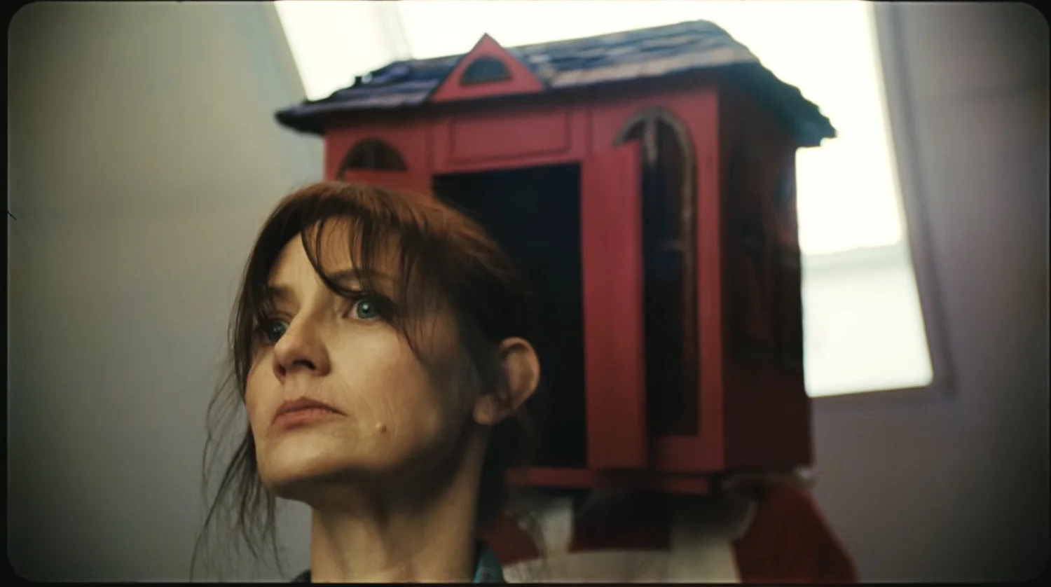 HOUSEWIFE is a Twisted 35mm Horror Short About a Murderous Monster With a Dollhouse for a Head